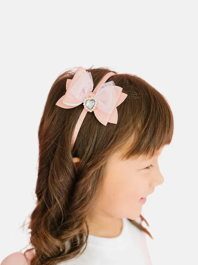 Bandeau à nœud pailleté avec breloque en forme de cœur Sweet Wink