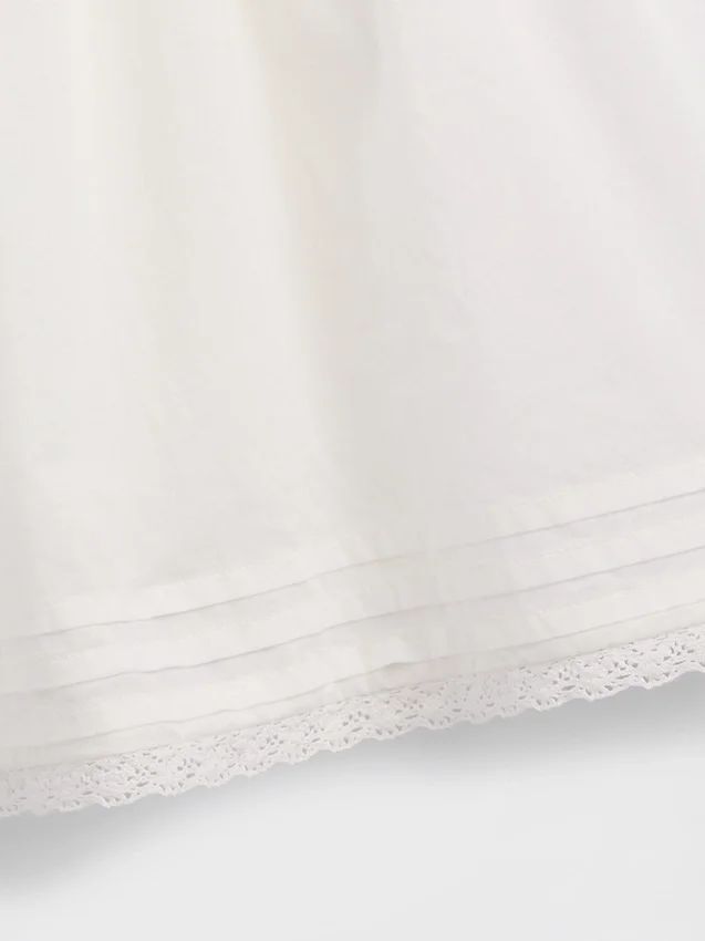 Combinaison pour enfant à bordures en dentelle