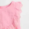 Ensemble pour bébé à volants et œillets
