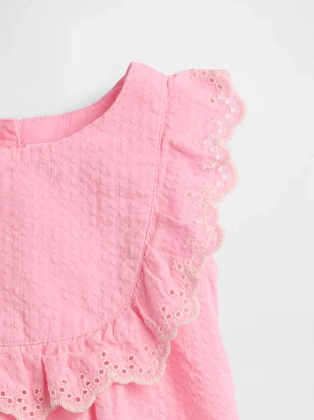 Ensemble pour bébé à volants et œillets