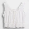 Haut court à basque et nouage sur le devant avec œillets