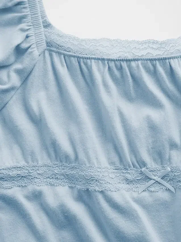 Haut à manches bouffantes et bordures en dentelle pour enfants