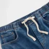 Jeans baggy en denim tricoté à taille mi-haute