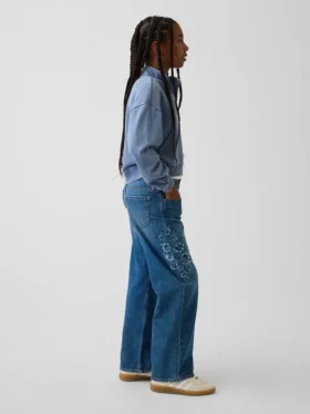 Jeans pour enfant à taille basse, coupe large et motif floral brodé