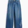 Jeans pour enfant à taille basse, coupe large et motif floral brodé