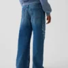 Jeans pour enfant à taille basse, coupe large et motif floral brodé