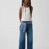Jeans pour enfant à taille basse, coupe large et motif floral brodé