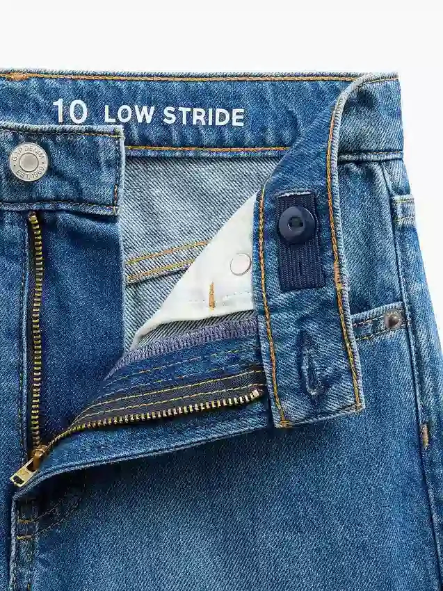 Jeans pour enfant à taille basse, coupe large et motif floral brodé
