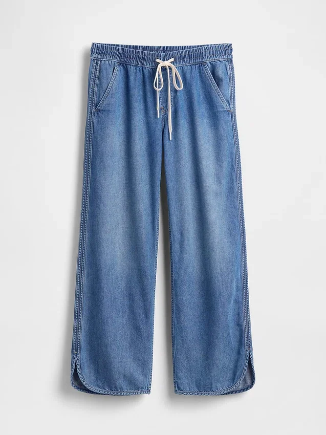 Jeans taille basse ultra-doux, ample style années 90, à ourlet en forme de dauphin