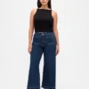 Jeans taille haute à coupe ample et jambes larges, longueur cheville, pour silhouettes rondes