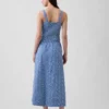 Jupe longue à œillets à taille haute