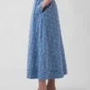 Jupe longue à œillets à taille haute