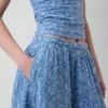 Jupe longue à œillets à taille haute