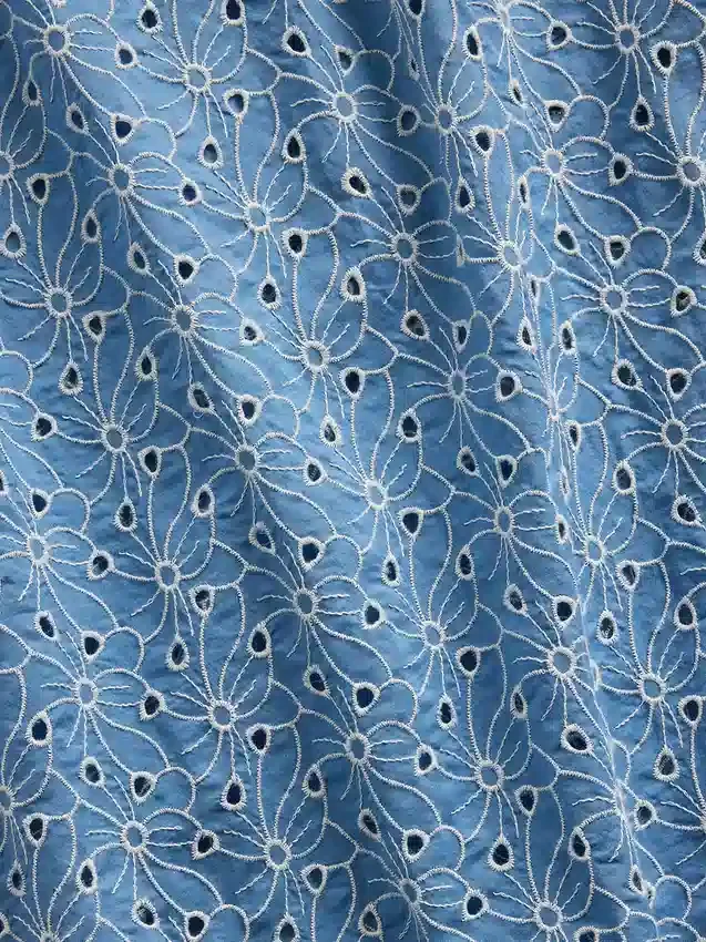 Jupe longue à œillets à taille haute