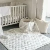 Le tapis de jeu matelassé « Safari Toile » de The Gilded Bird