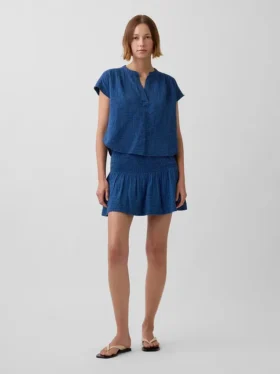 Mini-jupe-short en denim de gaze de coton à taille smockée