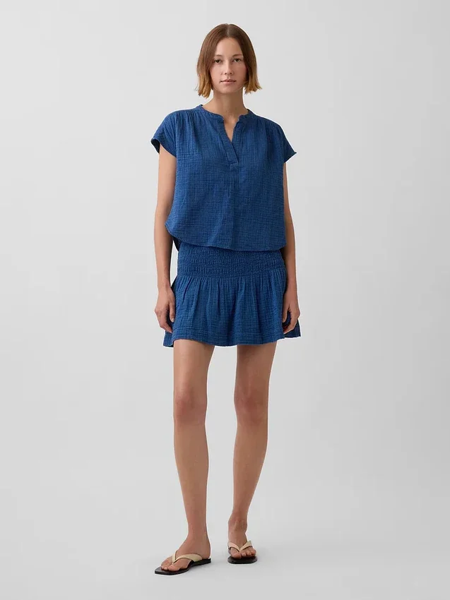 Mini-jupe-short en denim de gaze de coton à taille smockée
