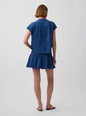 Mini-jupe-short en denim de gaze de coton à taille smockée