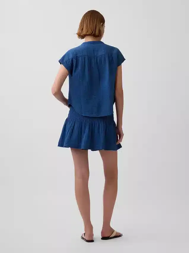 Mini-jupe-short en denim de gaze de coton à taille smockée