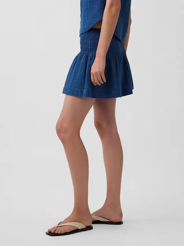 Mini-jupe-short en denim de gaze de coton à taille smockée