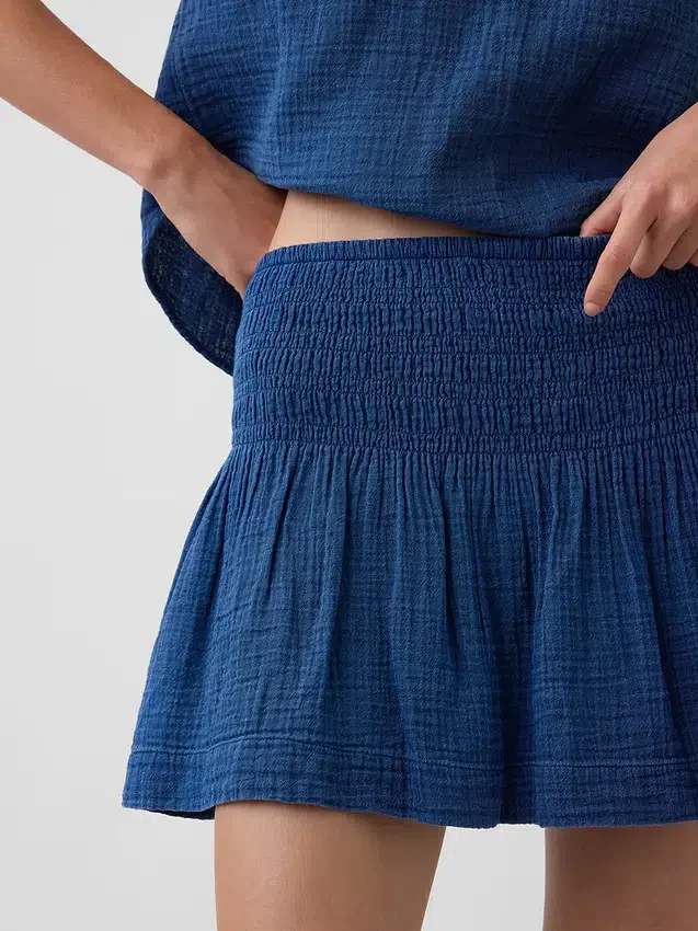 Mini-jupe-short en denim de gaze de coton à taille smockée