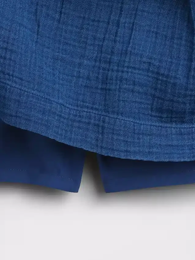 Mini-jupe-short en denim de gaze de coton à taille smockée