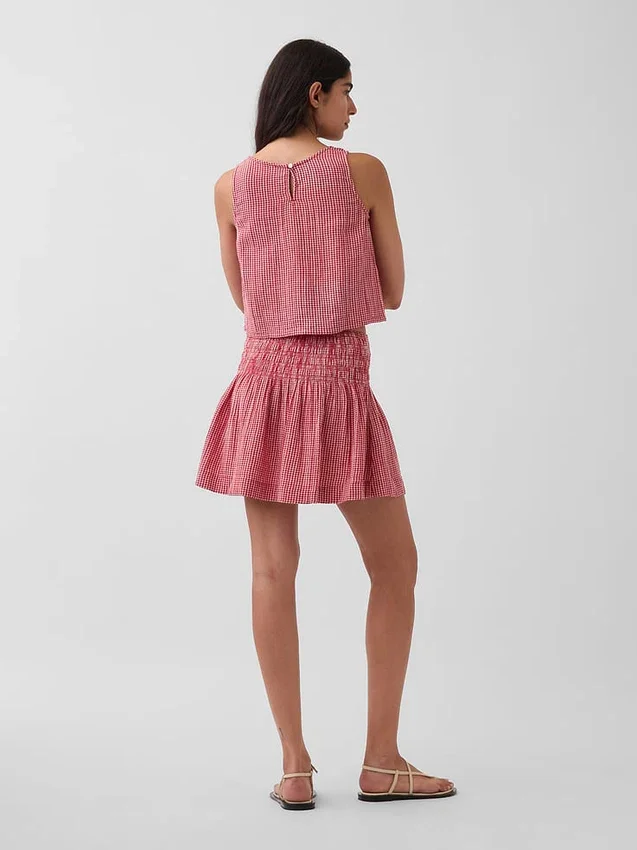 Mini-jupe-short en gaze de coton à taille smockée