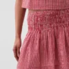 Mini-jupe-short en gaze de coton à taille smockée