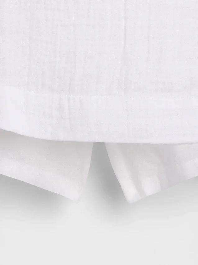Mini-jupe-short en gaze de coton à taille smockée