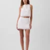 Mini-jupe-short en mélange de lin avec bordure en dentelle