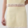 Mini-jupe-short en mélange de lin avec bordure en dentelle