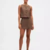 Mini-jupe-short en mélange de lin à boutonnage sur le devant