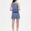 Mini-jupe-short en mélange de lin à boutonnage sur le devant