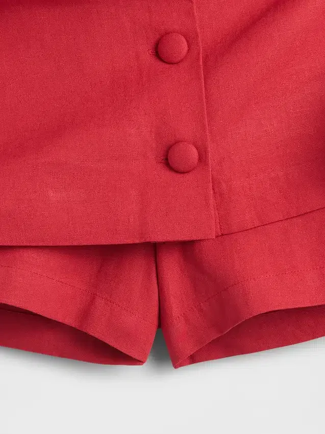 Mini-jupe-short en mélange de lin à boutonnage sur le devant