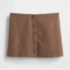 Mini-jupe-short en mélange de lin à boutonnage sur le devant