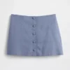Mini-jupe-short en mélange de lin à boutonnage sur le devant