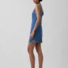 Mini-robe en denim à col bateau et dos nu