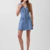 Mini-robe en denim à coutures apparentes et fermeture éclair sur le devant