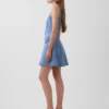 Mini-robe en denim à coutures apparentes et fermeture éclair sur le devant