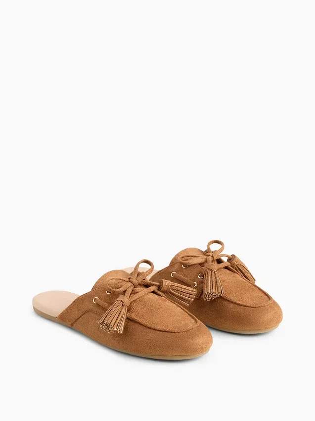 Mules mocassins à pompons en daim vegan