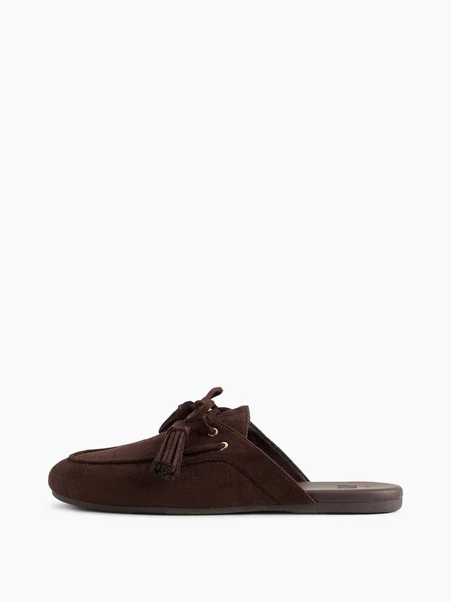 Mules mocassins à pompons en daim vegan