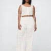 Pantalon ample à taille mi-haute et œillets