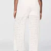 Pantalon ample à taille mi-haute et œillets