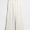Pantalon ample à taille mi-haute et œillets