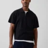 Polo-pull oversize à poche et fermeture à quart de zip