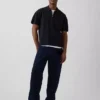 Polo-pull oversize à poche et fermeture à quart de zip