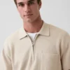 Polo-pull oversize à poche et fermeture à quart de zip