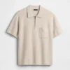 Polo-pull oversize à poche et fermeture à quart de zip