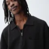 Polo-pull oversize à poche et fermeture à quart de zip