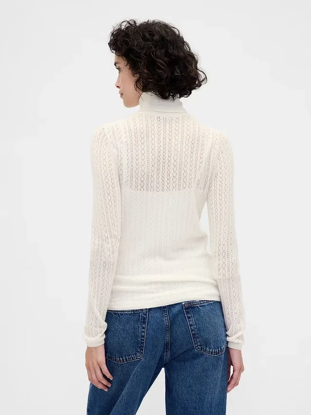 Pull à col roulé en maille pointelle